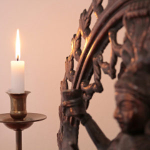 Statue Of The Goddess Shiva With Candle